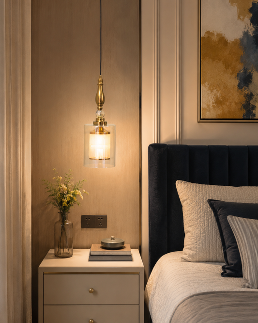 Modern clear glass pendant light beside bed