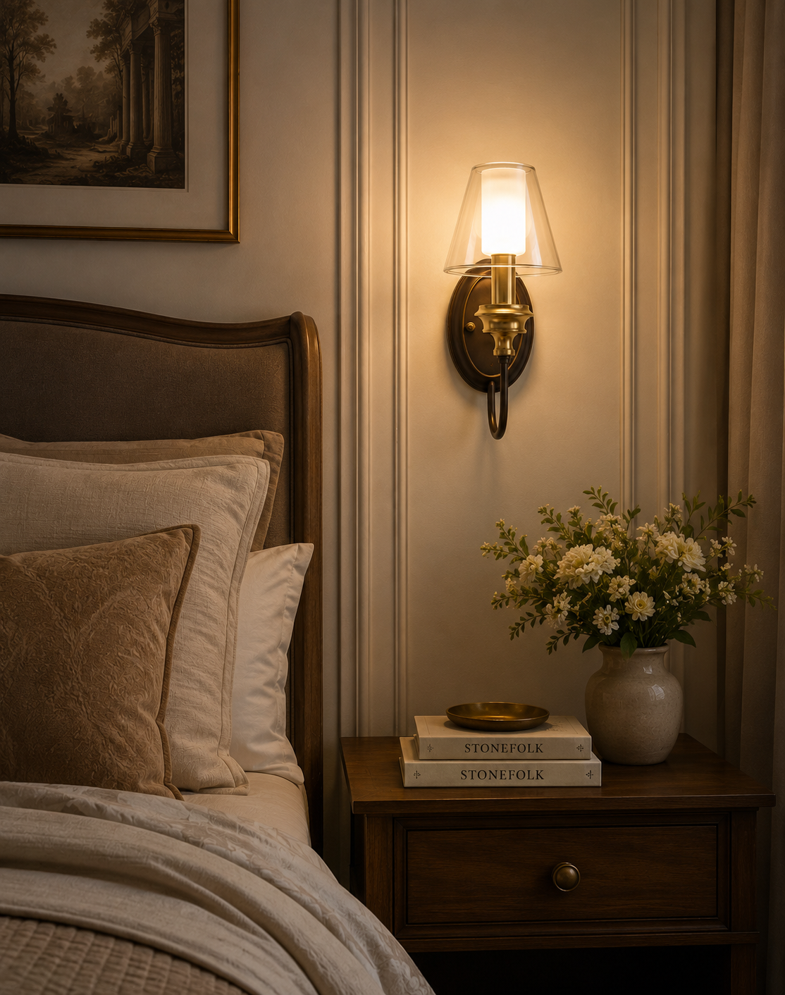 Cozy bedroom with bed, nightstand, wall sconce, and decorative items.